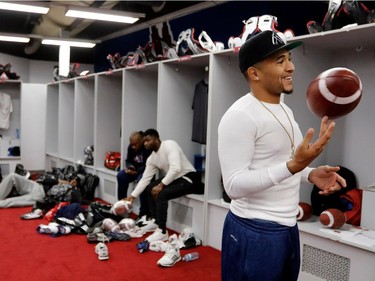 Montreal Alouettes quarterback Vernon Adams Jr. spins a football on his finger as he tosses the ball around the locker- room in Montreal on Sunday, Nov. 6, 2016.