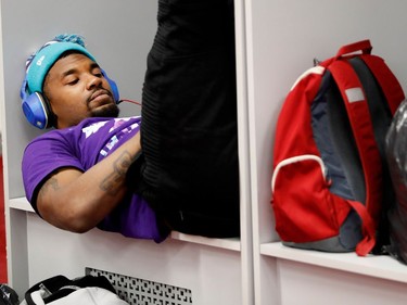 Montreal Alouettes running back Tyrell Sutton sits in his locker as he waits for his turn to see the team doctors as they clean out their locker-room in Montreal on Sunday, Nov. 6, 2016.