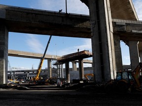 A worker secures rebar to a new pillar of the Turcot Exchange project Nov. 9, 2016.