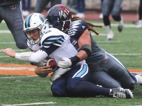 Montreal Alouettes middle-linebacker Bear Woods brings down Argonauts quarterback Drew Willy on Oct. 2, 2016. (Pierre Obendrauf/