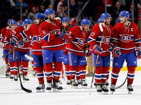 Montreal Canadiens centre Torrey Mitchell (17) and Montreal Canadiens left wing Max Pacioretty (67) lead the team to centre ice after beating the Tampa Bay Lightning during NHL action at the Bell Centre in Montreal on Thursday October 27, 2016.