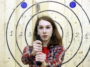 Kayla Henry holds an axe at Bad Axe Throwing Montreal on October 29, 2016.