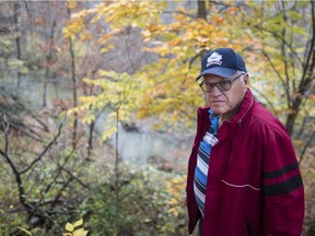 St-Lazare resident Richard Meades walks through an location in the Chaline Valley area with risk of mudslides near the corner of Charbonneau and Carillion streets in the town of St-Lazare. (Dario Ayala / Montreal Gazette)