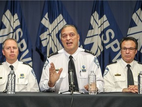Montreal police Chief Philippe Pichet, flanked by deputy directors Claude Bussière, left, and Bernard Lamothe, speaks to reporters about the force's tracking of LaPresse reporter Patrick Lagacé, at police headquarters in Montreal Monday October 31, 2016. (John Mahoney / MONTREAL GAZETTE)