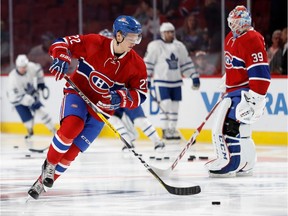 Montreal Canadiens defenceman Mikhail Sergachev, left, and Montreal Canadiens goalie Mike Condon take part in the pregame warmup skate during NHL pre-season action against the Toronto Maple Leafs at the Bell centre in Montreal on Thursday October 6, 2016.