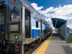 A double decker AMT commuter train, fabricated by the Bombardier Train Division, prepares to depart from the Vaudreuil commuter station in Vaudreuil,