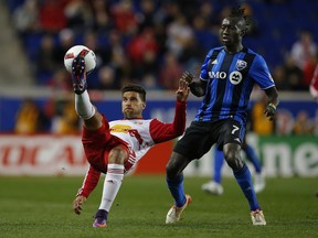 New York Red Bulls midfielder Sal Zizzo (15) controls the ball in front of Montreal Impact forward Dominic Oduro (7) in the first half of an MLS Eastern Conference Semifinal soccer match at Red Bull Arena in Harrison, N.J., Sunday, Nov. 6, 2016.