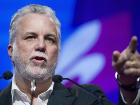 "It's horrible, horrible, what happened, violent, gratuitous," Philippe Couillard said Friday.