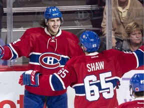 Montreal Canadiens' Phillip Danault, left, celebrates his goal past Los Angeles Kings goalie Peter Budaj with teammate Andrew Shaw during second period NHL hockey action Thursday, November 10, 2016 in Montreal.