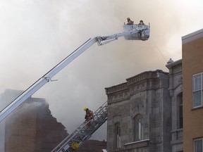 Firefighters battle a blaze on Park Ave. near Milton St. in Plateau-Mont-Royal Nov. 23, 2016.