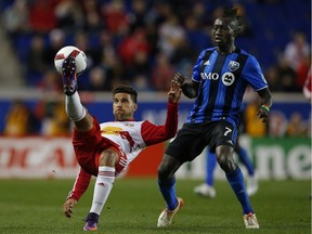 New York Red Bulls midfielder Sal Zizzo (15) controls the ball in front of Montreal Impact forward Dominic Oduro (7) in the first half of an MLS Eastern Conference Semifinal soccer match at Red Bull Arena in Harrison, N.J., Sunday, Nov. 6, 2016.