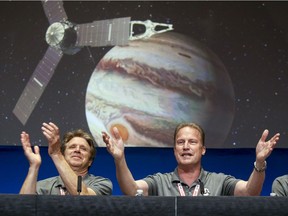 Scott Bolton, left, and Rick Nybakken at NASA's Jet Propulsion Laboratory when the solar-powered Juno spacecraft entered orbit around Jupiter in July 2016.