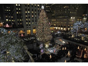 The Rockefeller Center Christmas Tree is lit during the 80th annual tree lighting ceremony at Rockefeller Center in New York, Wednesday, Nov. 28, 2012.