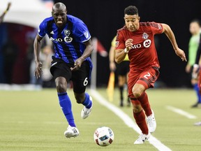 Justin Morrow #2 of the Toronto FC plays the ball past Hassoun Camara #6 of the Montreal Impact during leg one of the MLS Eastern Conference finals at Olympic Stadium on November 22, 2016 in Montreal, Quebec, Canada.  The Montreal Impact defeated the Toronto FC 3-2.