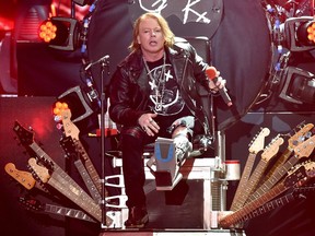 Axl Rose performs with Guns N' Roses at the Coachella festival in California in April 2016; Rose had broken his foot earlier that month. Tickets for the band's Montreal show go on sale Friday, Dec. 9, ranging in price from $158 to $433.