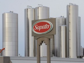 A sign at a Montreal Saputo plant is pictured on Jan. 13, 2014.