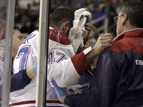 Canadiens' Alexander Radulov is assisted off the ice with a head injury during the third period of the team's NHL hockey game against the San Jose Sharks on Friday, Dec. 2, 2016, in San Jose, Calif.