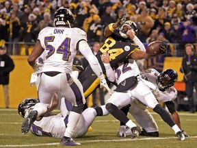 Steelers wide-receiver Antonio Brown (84) reaches the ball across the goal line for a touchdown against the Baltimore Ravens in Pittsburgh on Sunday, Dec. 25, 2016. The Steelers won 31-27.
