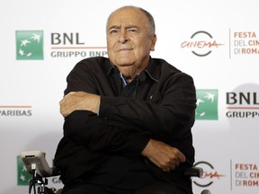 In this Oct. 15, 2016, file photo, director Bernardo Bertolucci poses for photographers during a photo call at the Rome Film festival in Rome.