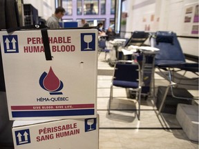 Blood is collected at a clinic Thursday, November 29, 2012 in Montreal. Hema Quebec, the provincial blood agency, said that as much as 70 per cent of the blood inventory stockpiled for transfusion had been placed temporarily aside, while tests are conducted.