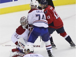 Canadiens goalie Carey Price and teammate Alexei Emelin of Russia, defend against Capitals' Jakub Vrana of the Czech Republic during the third period of an NHL hockey game in Washington on Saturday, Dec. 17, 2016.