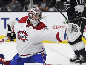 Canadiens goalie Carey Price reaches for the puck as it flies past the goal against the Los Angeles Kings on Sunday, Dec. 4, 2016, in Los Angeles.