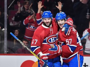 Canadiens' Max Pacioretty celebrates his hat-trick goal with teammate Alexander Radulov against the Colorado Avalanche at the Bell Centre on Saturday, Dec. 10, 2016.