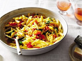 Roasted cherry tomatoes and corn kernels brighten up a dish of pasta flavoured with Parmesan cheese and basil.