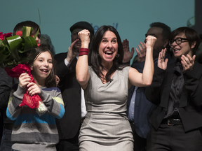 Projet Montreal's Valérie Plante, centre, celebrates after winning the leadership race with 51.9% of the vote at the Olympia Theatre in Montreal on Sunday.