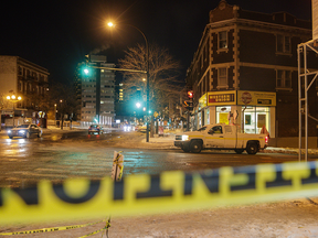Police tape at the intersection where a man was killed after being hit by a snow removal truck at the intersection of Sherbrooke St. and Girouard Ave. in Montreal on Monday, December 19, 2016.