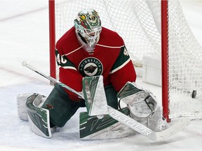 Minnesota Wild goalie Devan Dubnyk deflects a shot during the third period of an NHL hockey game against the Colorado Avalanche Tuesday, Dec. 20, 2016, in St. Paul, Minn. The Wild won 2-0.