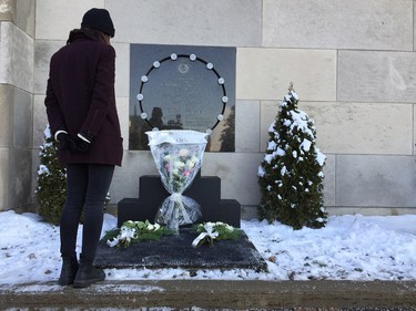 Clara Levy-Provençal takes a moment to remember the victims of the 1989 École Polytechnique massacre, Dec. 6, 2016.
