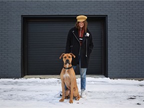 Fez the Rhodesian Ridgeback-Great Dane mix "sitting nice" with owner Linny Ganten.
(Photo by Paul Labonté)