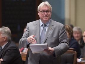 Health Minister Gaétan Barrette tables a bill at the National Assembly.