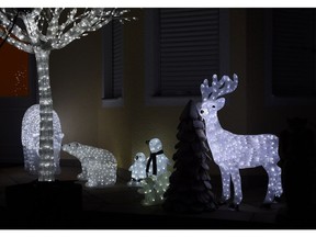 An entrance of a residential house in the small Bavarian village Eichenau near Munich, southern Germany, is decorated with Christmas lights on December 9, 2016, two weeks before Christmas.  /