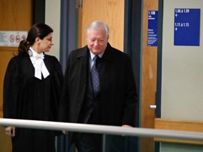 Former Laval mayor Gilles Vaillancourt arrives at the courthouse with his lawyer Nadia Touma, Dec. 1, 2016.