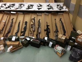 A police handout photo of some of the guns seized by Longueuil police from a home.