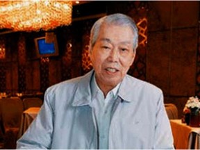 In this 2008 photo, chef Peng Chang-kuei poses for a photo as he is seated at a table in his restaurant Peng's Garden in Taipei, Tawain. The chef, who has been credited with inventing General Tso's chicken, a world-famous Chinese food staple that is not served in China, has died in Taiwan. He was 98.