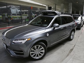 In this photo taken Tuesday, Dec. 13, 2016, an Uber driverless car heads out for a test drive in San Francisco. Uber is bringing a small number of self-driving cars to its ride-hailing service in San Francisco - a move likely to both excite the city's tech-savvy population and spark a conflict with California regulators. The Wednesday, Dec. 14, launch in Uber's hometown expands a public pilot program the company started in Pittsburgh in September.