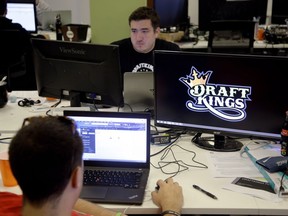 In this Wednesday, Sept. 9, 2015, photo, content-marketing manager Len Don Diego works at the Boston office of DraftKings, a daily fantasy sports company.