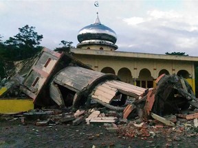 A collapsed mosque minaret is seen after a 6.5-magnitude earthquake struck the town of Pidie, in Indonesia's Aceh province in northern Sumatra, on December 7, 2016.