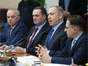 Israeli Prime Minister Benjamin Netanyahu chairs the weekly cabinet meeting in Jerusalem on December 25, 2016. Israel was defiant over a UN vote demanding it halt settlements in Palestinian territory, after lashing out at US President Barack Obama over the "shameful" resolution.