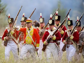 A line of British soldiers marches into battle during a War of 1812 re-enactment at Fanshawe Pioneer Village in London, Ont.