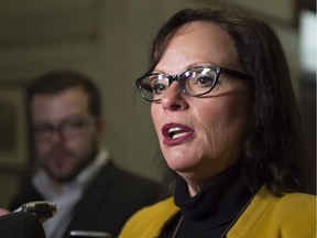 Lucie Charlebois, Quebec minister for Rehabilitation, Youth Protection and Public Health, responds to reporters' questions, in December at the legislature in Quebec City.