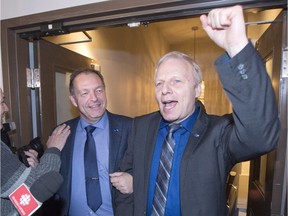 Parti Quebecois candidate Marc Bourcier, left, arrives with PQ leader Jean-Francois Lisee, after winning the provincial byelection to replace Pierre Karl Peladeau, Monday, December 5, 2016 in Saint-Jerome, Que.