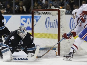 Montreal Canadiens' Brendan Gallagher, right, takes a shot against San Jose Sharks goalie Martin Jones (31) during the second period of an NHL hockey game Friday, Dec. 2, 2016, in San Jose, Calif.