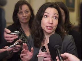 Parti Quebecois MNA Martine Ouellet responds to reporters question over the possibility of running at the Bloc Quebecois leadership, before entering a caucus meeting, Thursday, December 8, 2016 at the legislature in Quebec City.