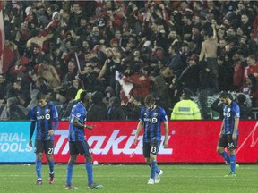 Montreal Impact players react after Toronto FC midfielder Benoit Cheyrou scored during overtime in Eastern Conference final MLS action in Toronto on Wednesday November 30, 2016.