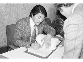 Inuit leader Zebedee Nungak signing the James Bay and Northern Quebec Agreement on November 11, 1975. (THE GAZETTE)