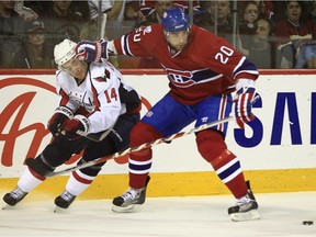 Montreal Canadiens defenceman Ryan O'Byrne pushes away Washington Capitals centre Tomas Fleischmann during first period NHL hockey action at the Bell Centre in Montreal on Wednesday April 21, 2009.